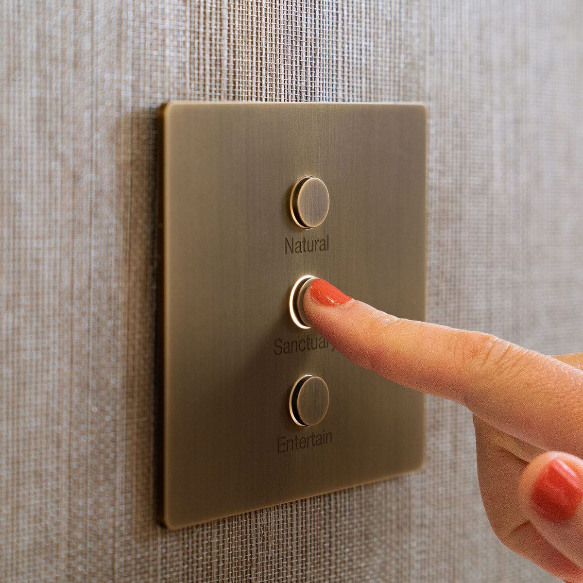 Lutron Alisse keypad in brushed brass with Natural, Sanctuary, and Entertain scene buttons