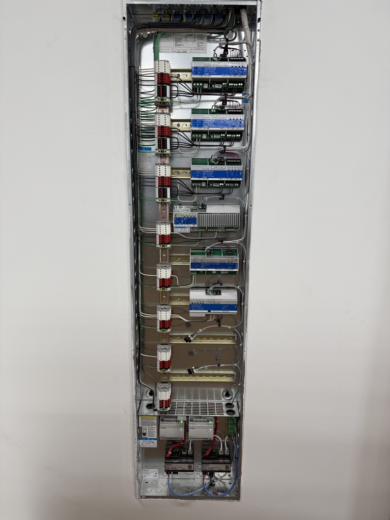 Lutron HomeWorks QSX lighting panel with organized dimming modules and processors