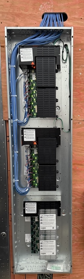 Lutron HomeWorks QSX shading panel with shade processors and network cabling